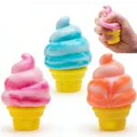 Hand holding the NeeDoh Nice Cream Cone Squishy, showing its swirled soft-serve top and ridged waffle cone base. — Image 1 of 6