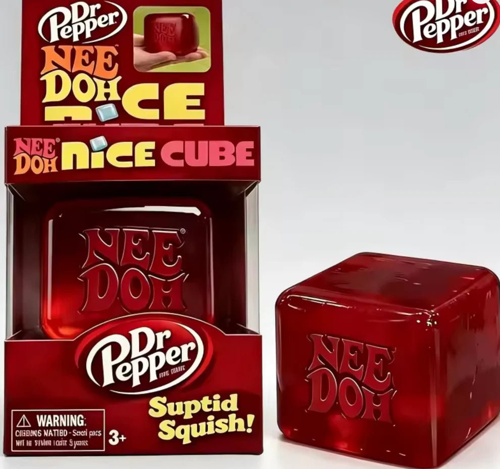 Close-up of a translucent red NeeDoh Dr Pepper Nice Cube with light shining through the squishy toy — Image 1 of 1