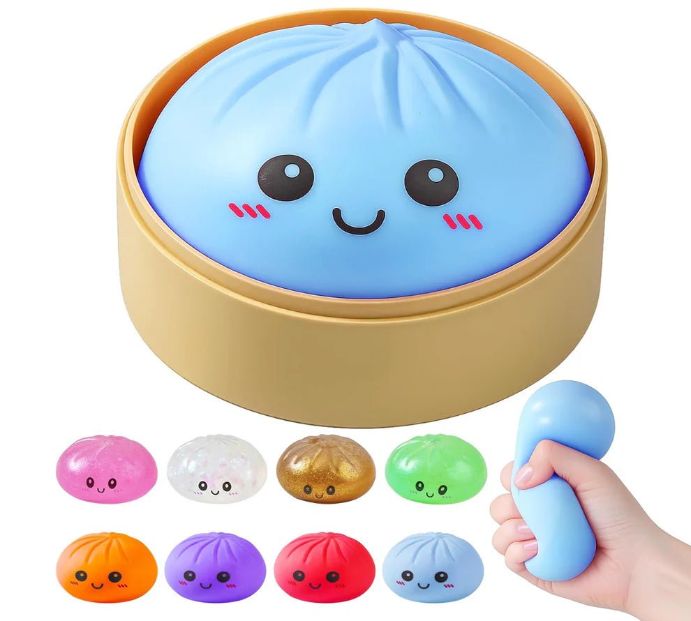 NeeDoh Mystery Dumpling bao bun squishy sitting in its mini bamboo-style steamer basket with the lid open — Image 1 of 1