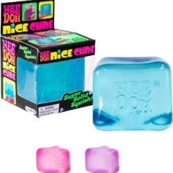 Frosted translucent NeeDoh Nice Cube ice-cube-shaped squishy in blue resting on a table, with soft light showing its see-through texture. — Image 1 of 6